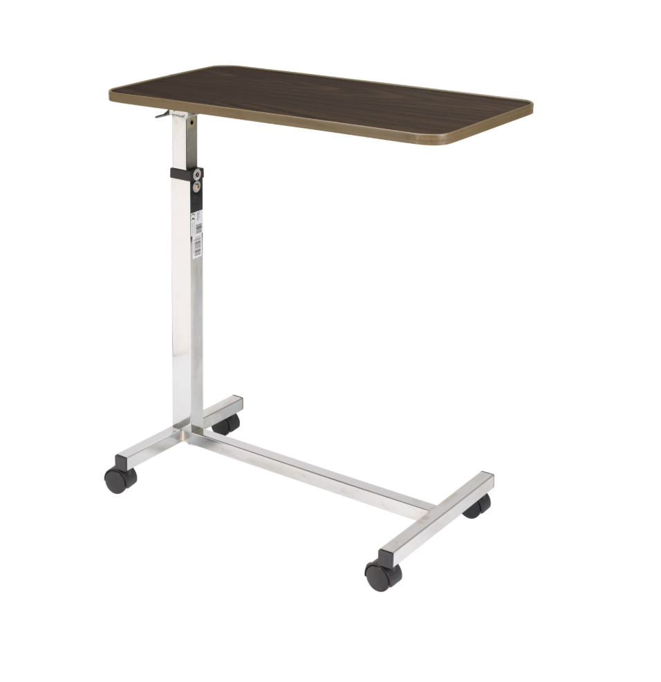 Adjustable hospital bed table with wooden top and metal frame on a white background