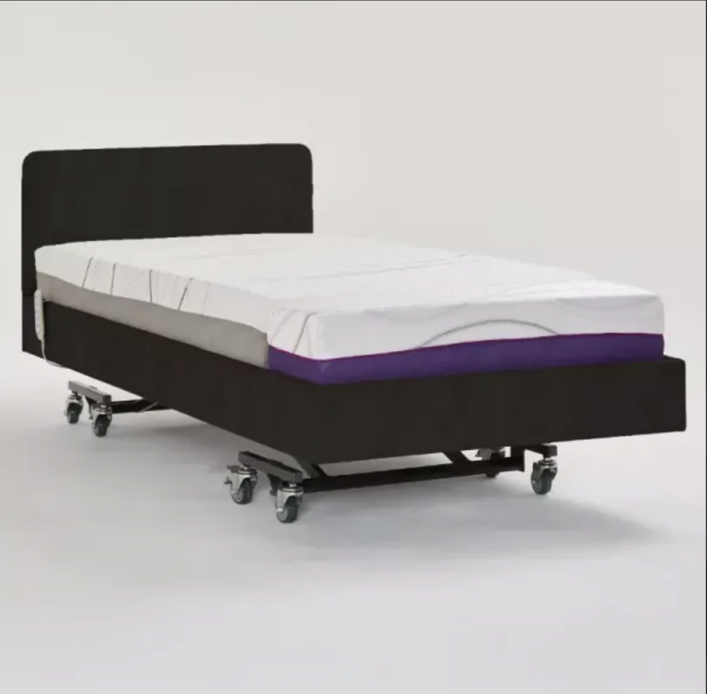 A wheeled hospital-style bed frame with a dark upholstered base and headboard, shown with a white mattress and a purple side accent on a light gray studio background.